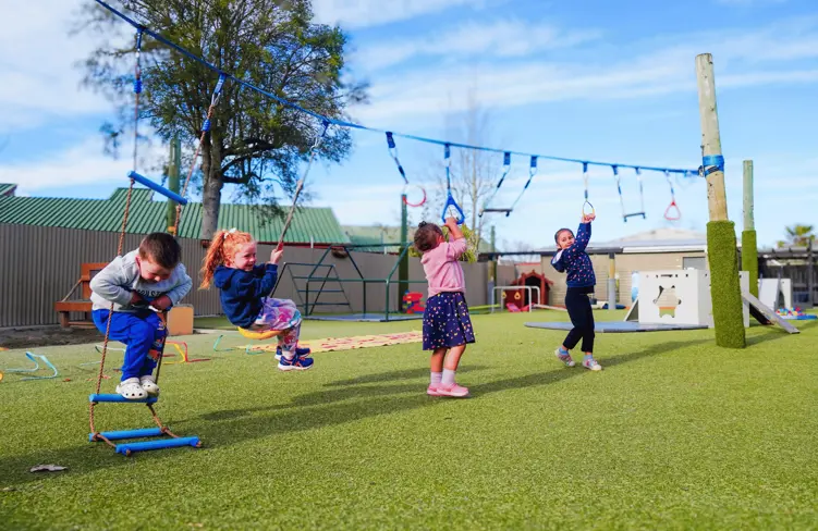 Children playing on a ninja slackline at Active Explorers Ashburton preschool