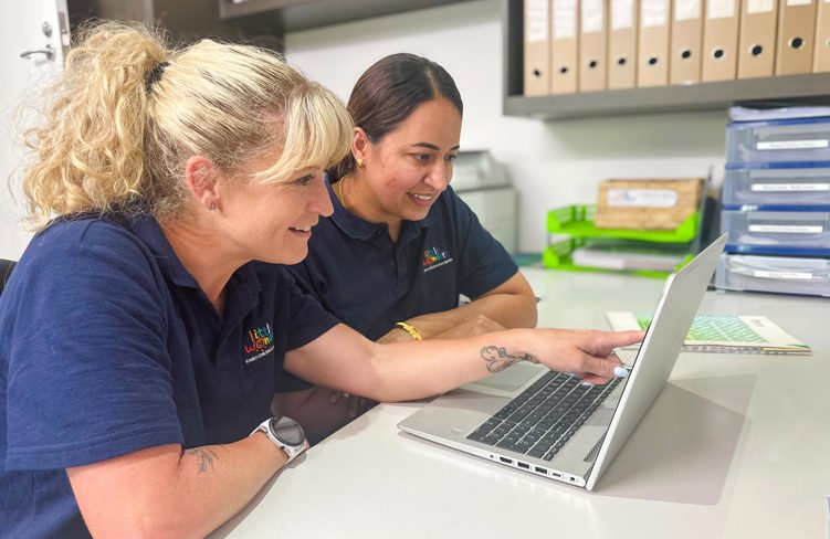 Evolve Education Teachers working together on laptop