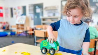 Evolve Education Preschool boy playing with care and playdough at daycare