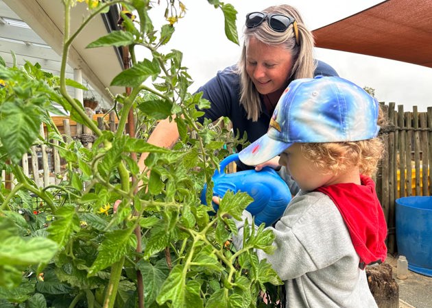 Evolve Education Teacher gardening with preschooler