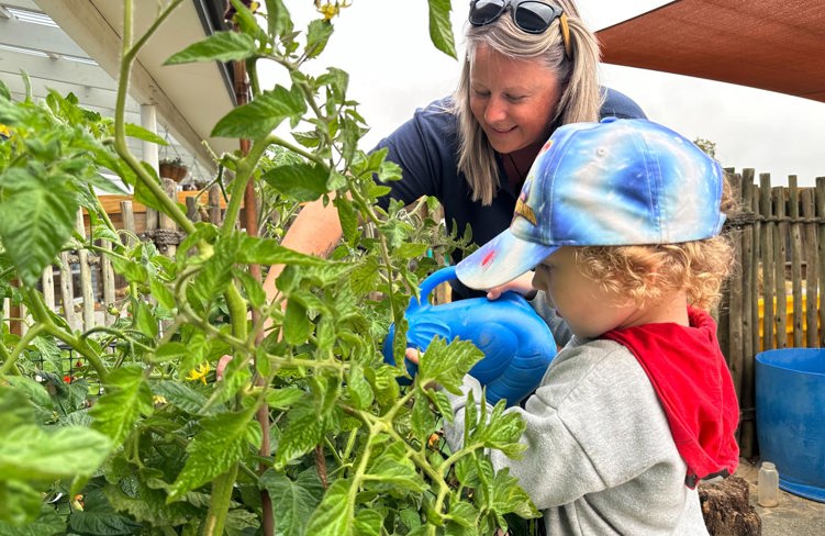 Evolve Education Teacher gardening with preschooler