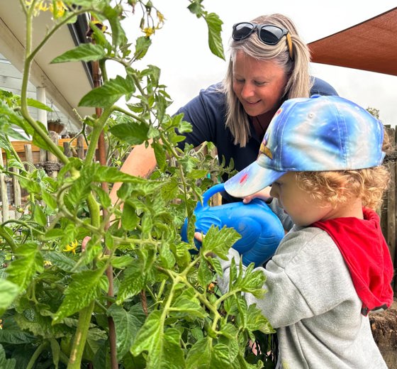 Evolve Education Teacher gardening with preschooler