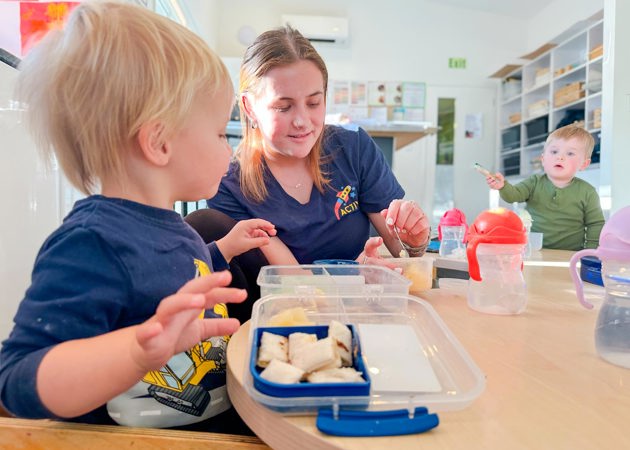 Evolve Education Teacher during lunch with toddlers